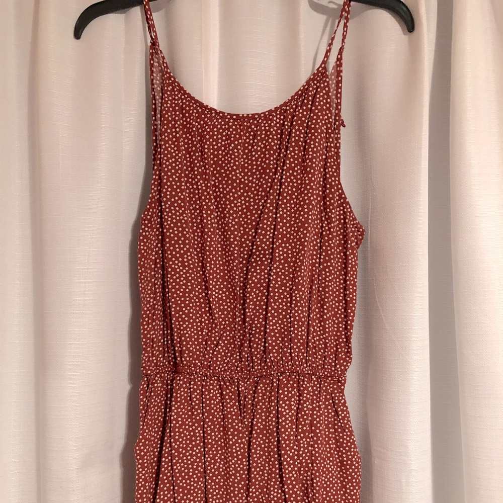red creamed dotted romper. short legged with spaghetti straps